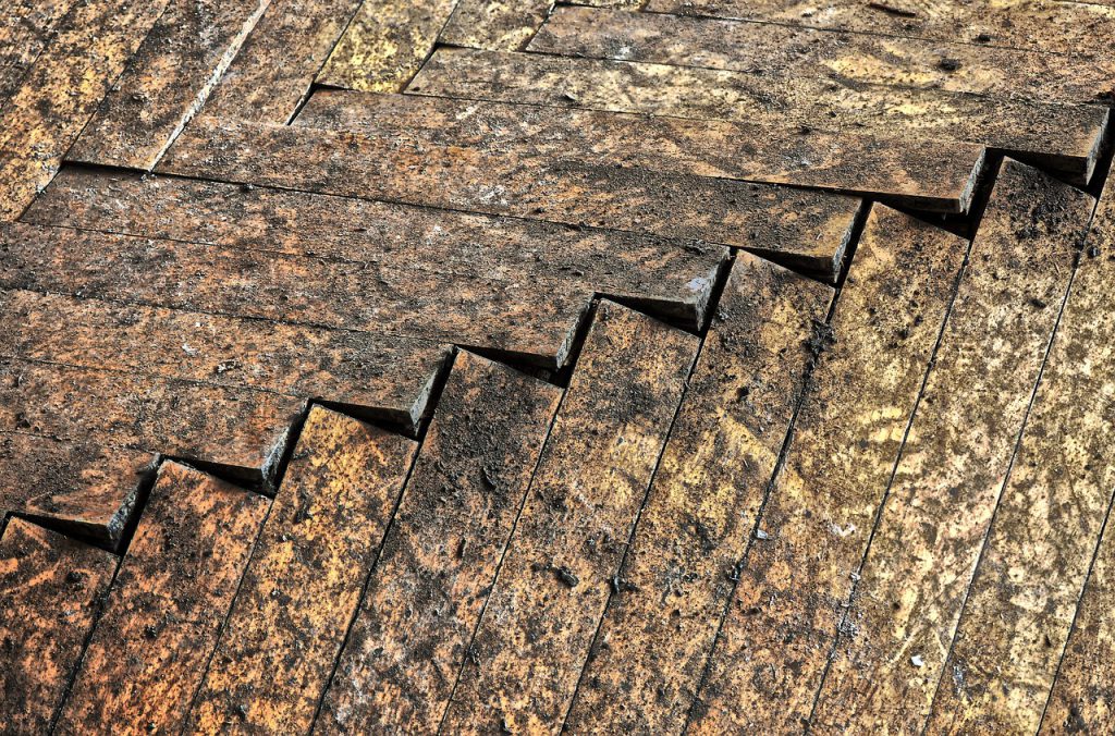 Water-damaged wood floor planks