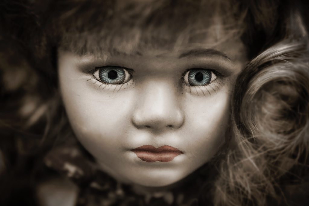 Closeup of doll face with blue eyes