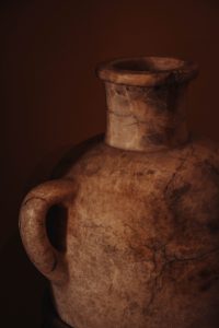 Closeup image of brown clay antique vase