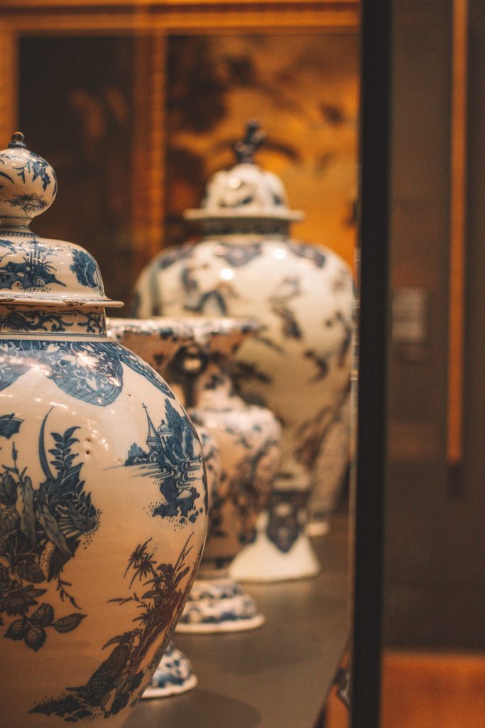 Antique white oriental vases with blue designs