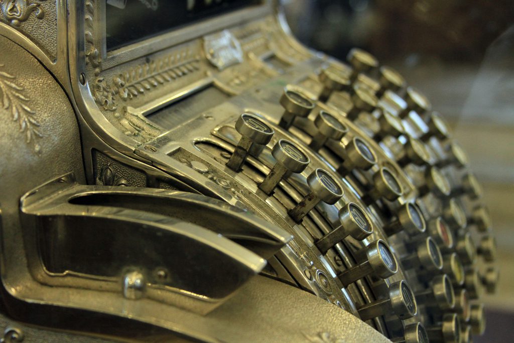 Closeup of keys on a metal vintage cash register
