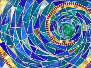 Swirling blue, green and red art glass mosaic