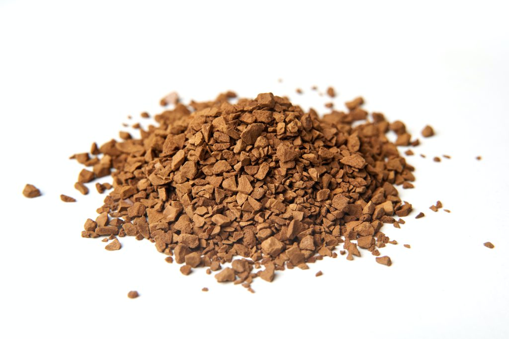 Coffee grounds against a white background