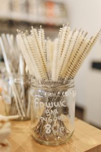 Glass jar filled with soft bristle brushes