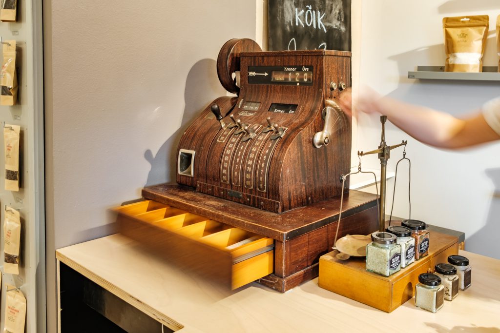 Vintage wooden cash register on a table