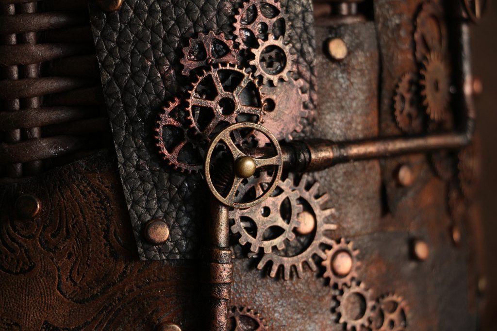 Rusted antique gears against a metal background